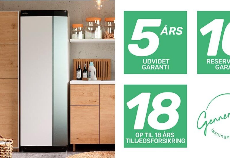 Vi Bygger Vejle: Hvidt apparat i moderne bryggers, med grønne ikoner for 5 års garanti, 10 års reservedele & 18 års forsikring.